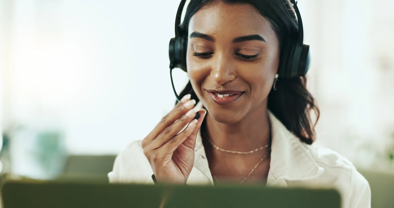 Smiling customer service agent with headset providing support
